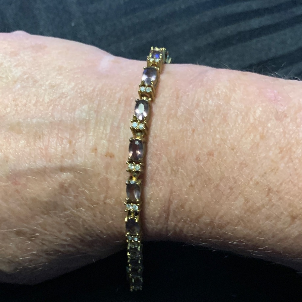 Like New Avon Gold and Amethyst Color Tennis Bracelet